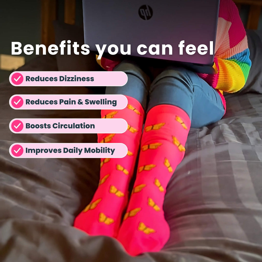 Lady wearing pink compressions socks sitting on bed