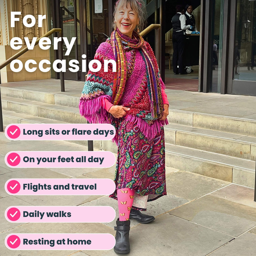 Lady wearing pink compression socks a with butterfly pattern outside theater