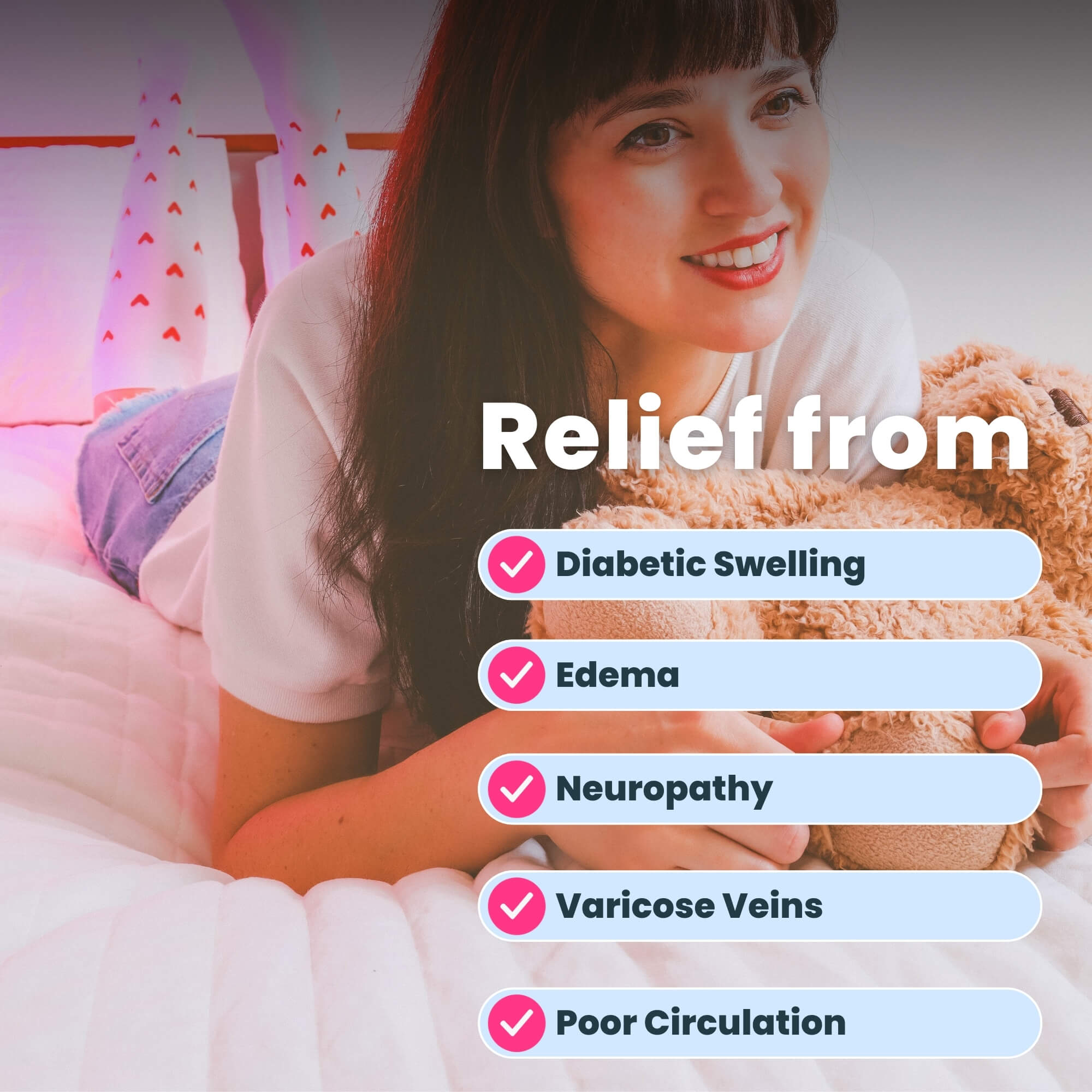 Woman wearing white compression socks with red heart patterns on bed with teddy