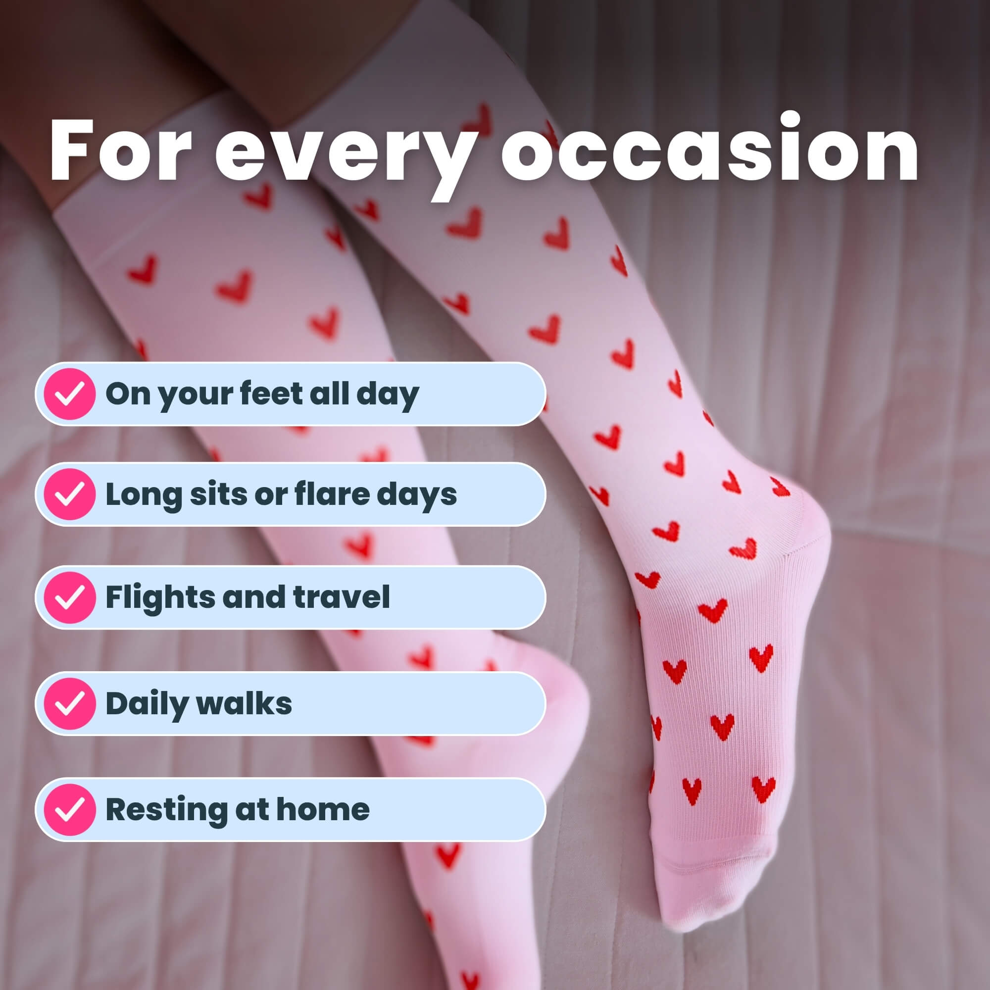 Woman wearing white compression socks with red heart patterns leg close up