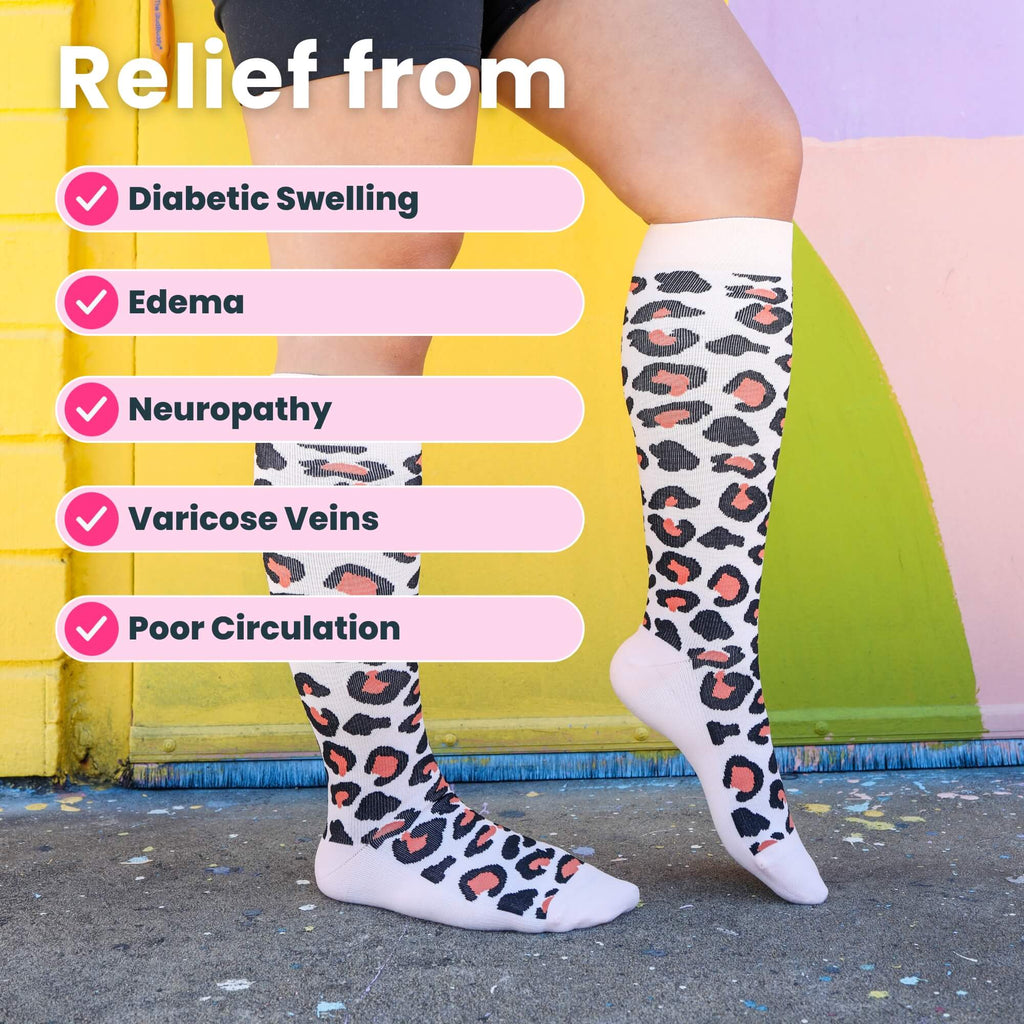 Woman wearing leopard print compression socks close up of legs