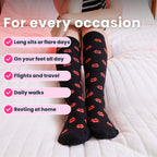 close up legs on bed in black compression socks with red lip prints