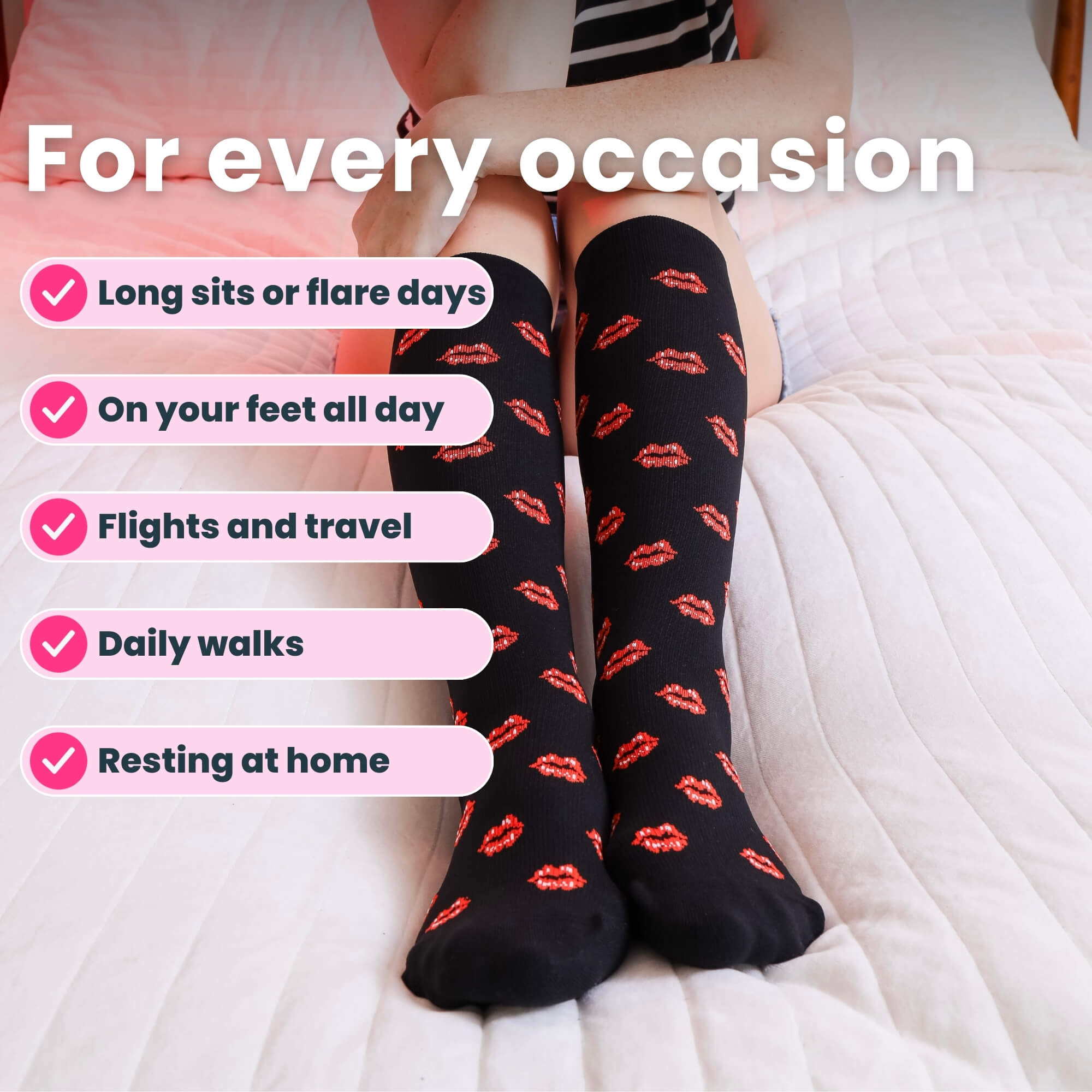 close up legs on bed in black compression socks with red lip prints