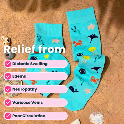 Teal compression socks with sea themed patterns in sand background