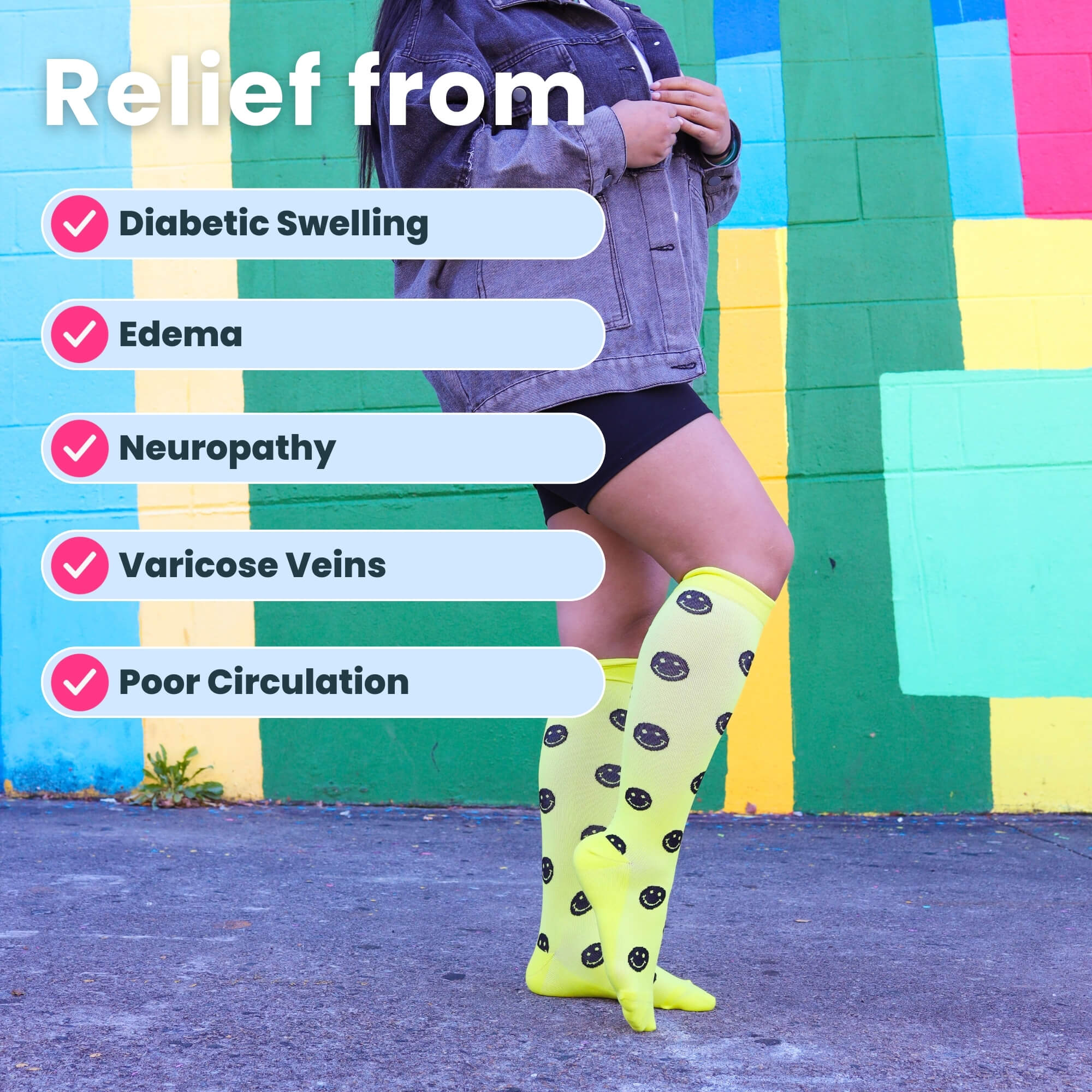 Woman posing in yellow compression socks with black smiley faces