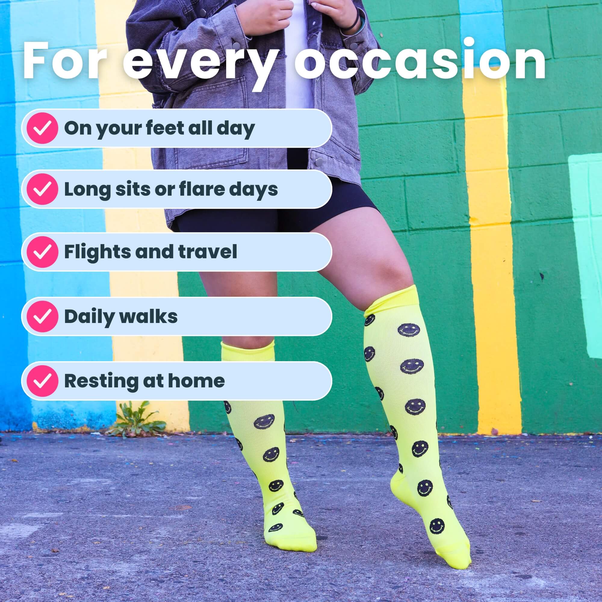 Woman posing in yellow compression socks with black smiley faces