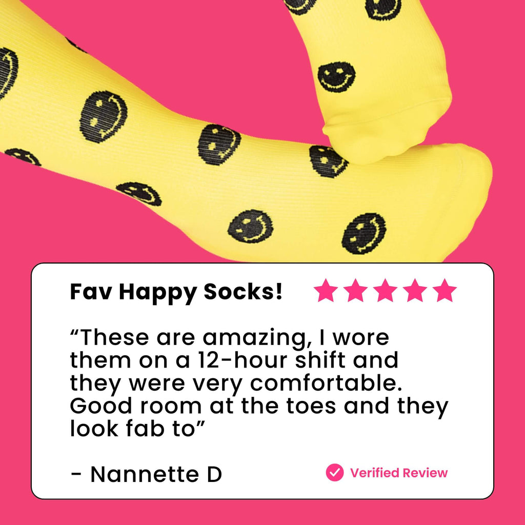 Woman wearing yellow compression socks with black smiley faces review text